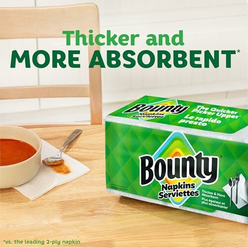 Bounty napkins next to a bowl of soup with a spill.