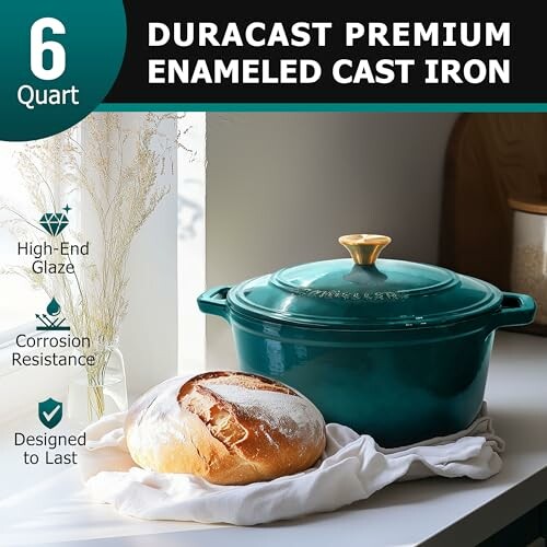 Duracast premium enameled cast iron pot with lid, 6 quart, alongside a loaf of bread on a kitchen counter.