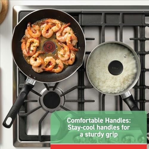 Shrimp cooking in pan and rice in pot on stove with stay-cool handles.