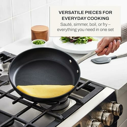 Person cooking an omelette in a non-stick pan on a stove.